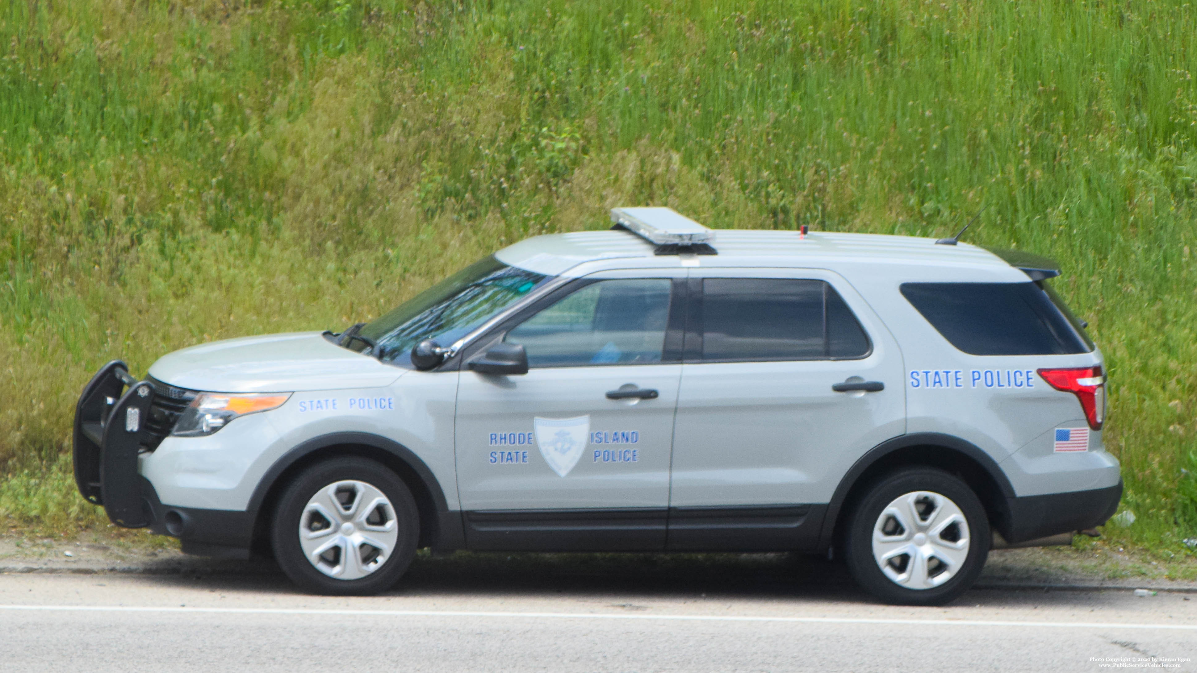 A photo  of Rhode Island State Police
            Cruiser 105, a 2013-2015 Ford Police Interceptor Utility             taken by Kieran Egan