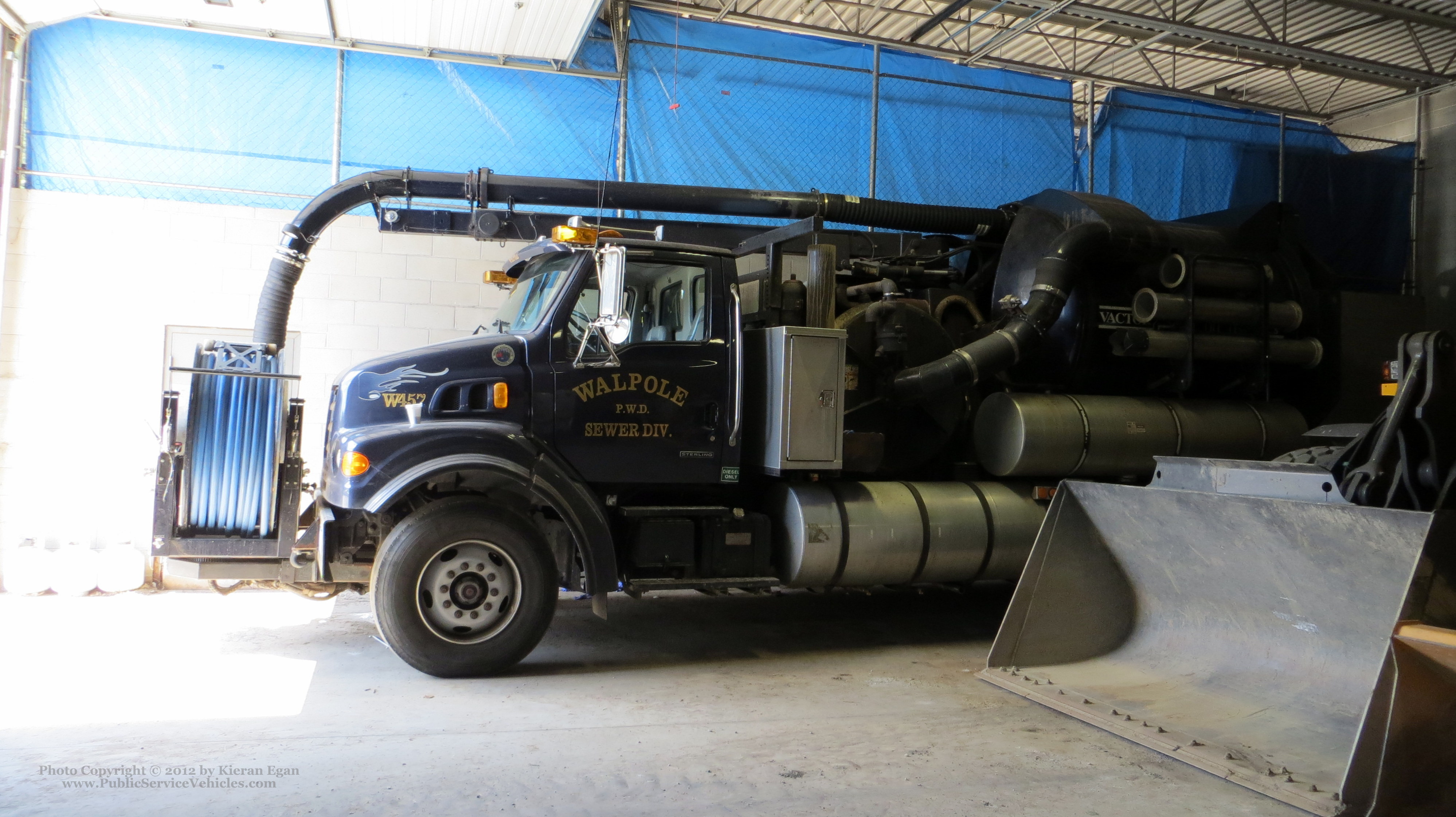 A photo  of Walpole Water Department
            Truck 457, a 2003 Sterling L8500/Vactor             taken by Kieran Egan