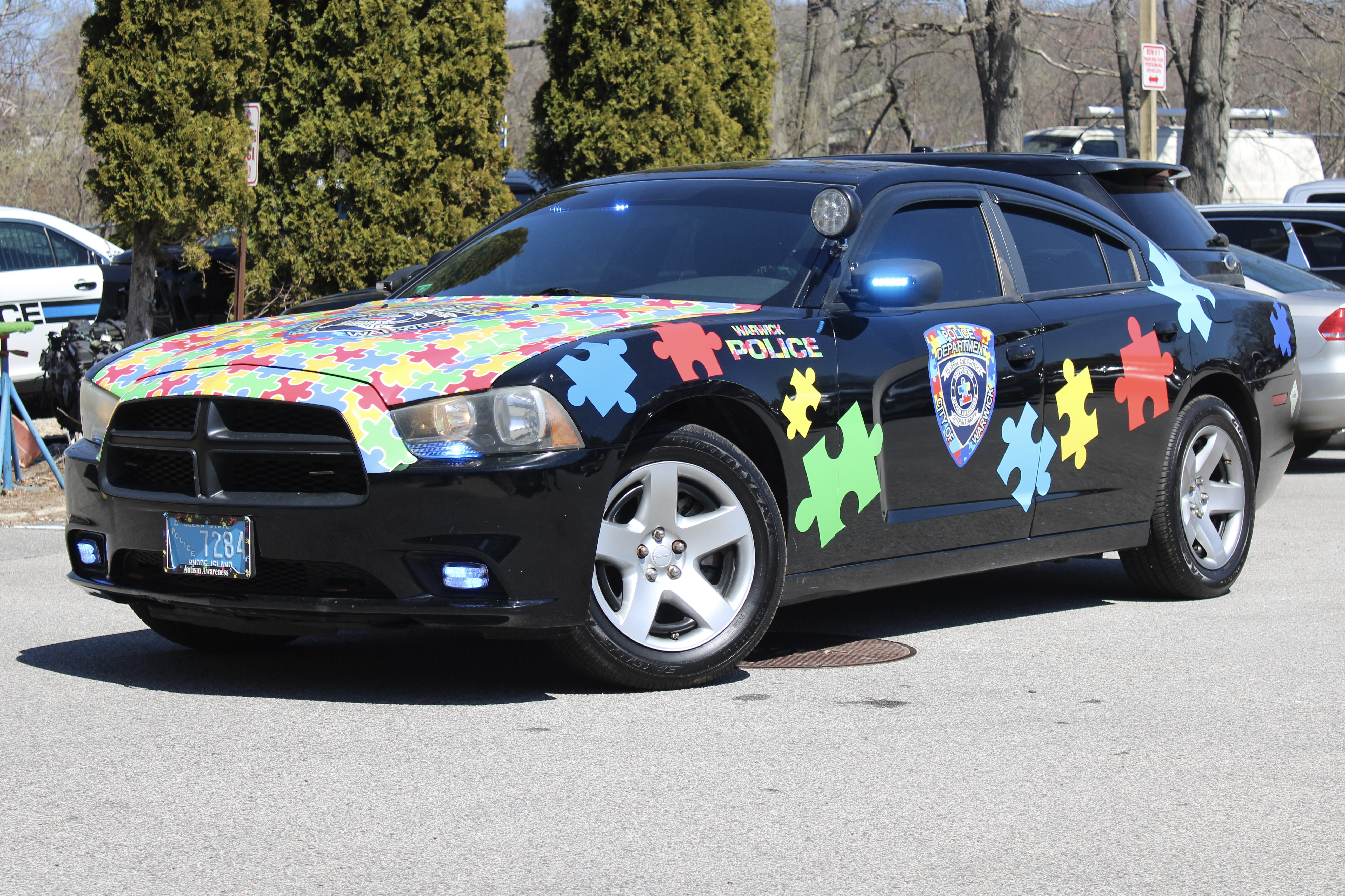 A photo  of Warwick Police
            Autism Awareness Unit, a 2011 Dodge Charger             taken by @riemergencyvehicles