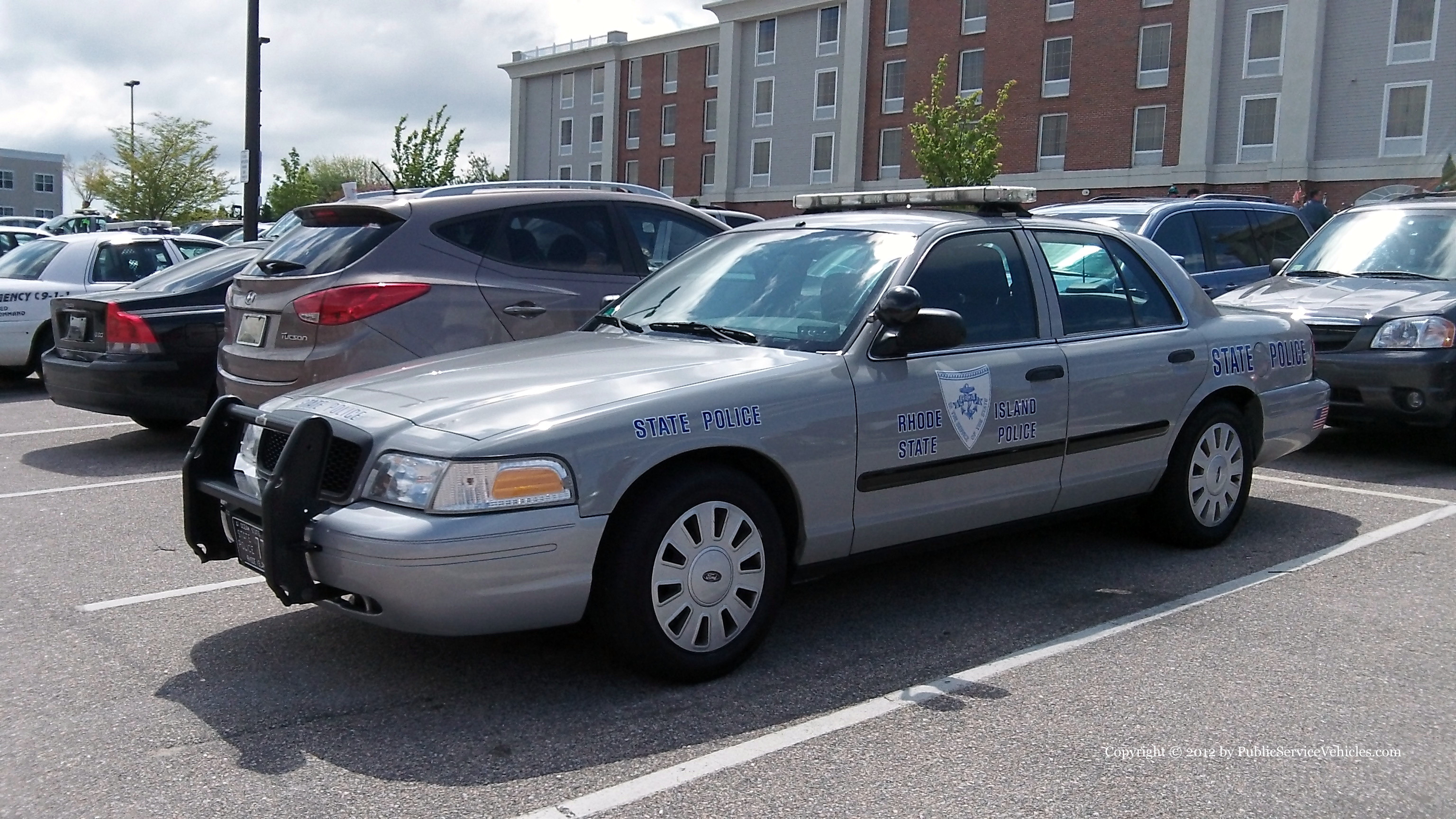 A photo  of Rhode Island State Police
            Cruiser 77, a 2006-2008 Ford Crown Victoria Police Interceptor             taken by Kieran Egan