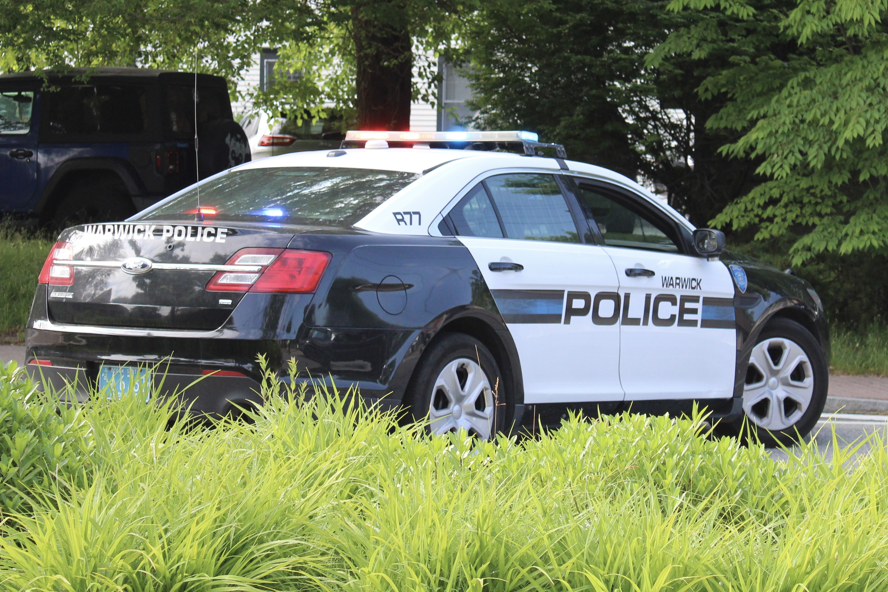 A photo  of Warwick Police
            Cruiser R-77, a 2015 Ford Police Interceptor Sedan             taken by @riemergencyvehicles