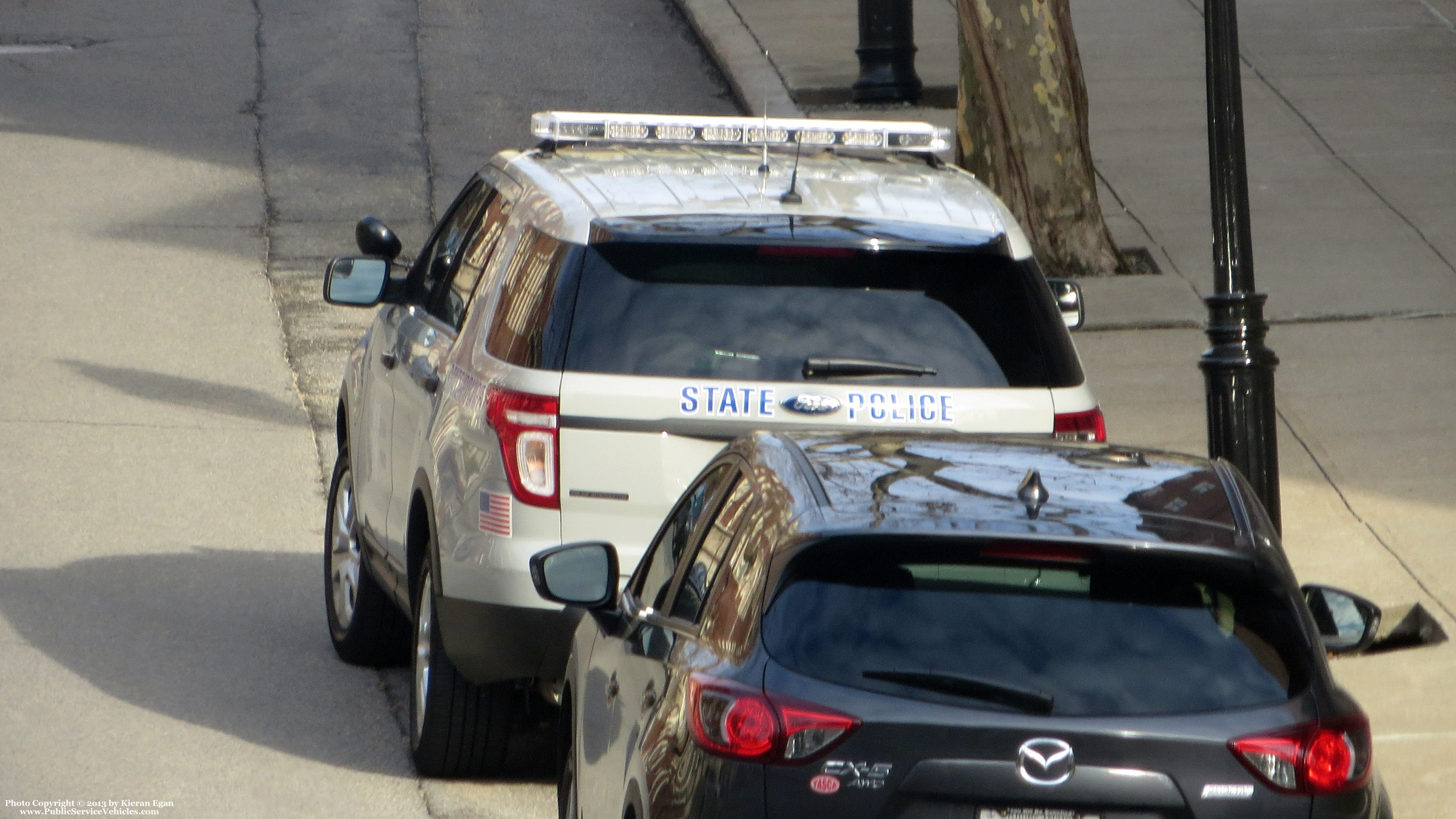 A photo  of Rhode Island State Police
            Cruiser 38, a 2013-2015 Ford Police Interceptor Utility             taken by Kieran Egan