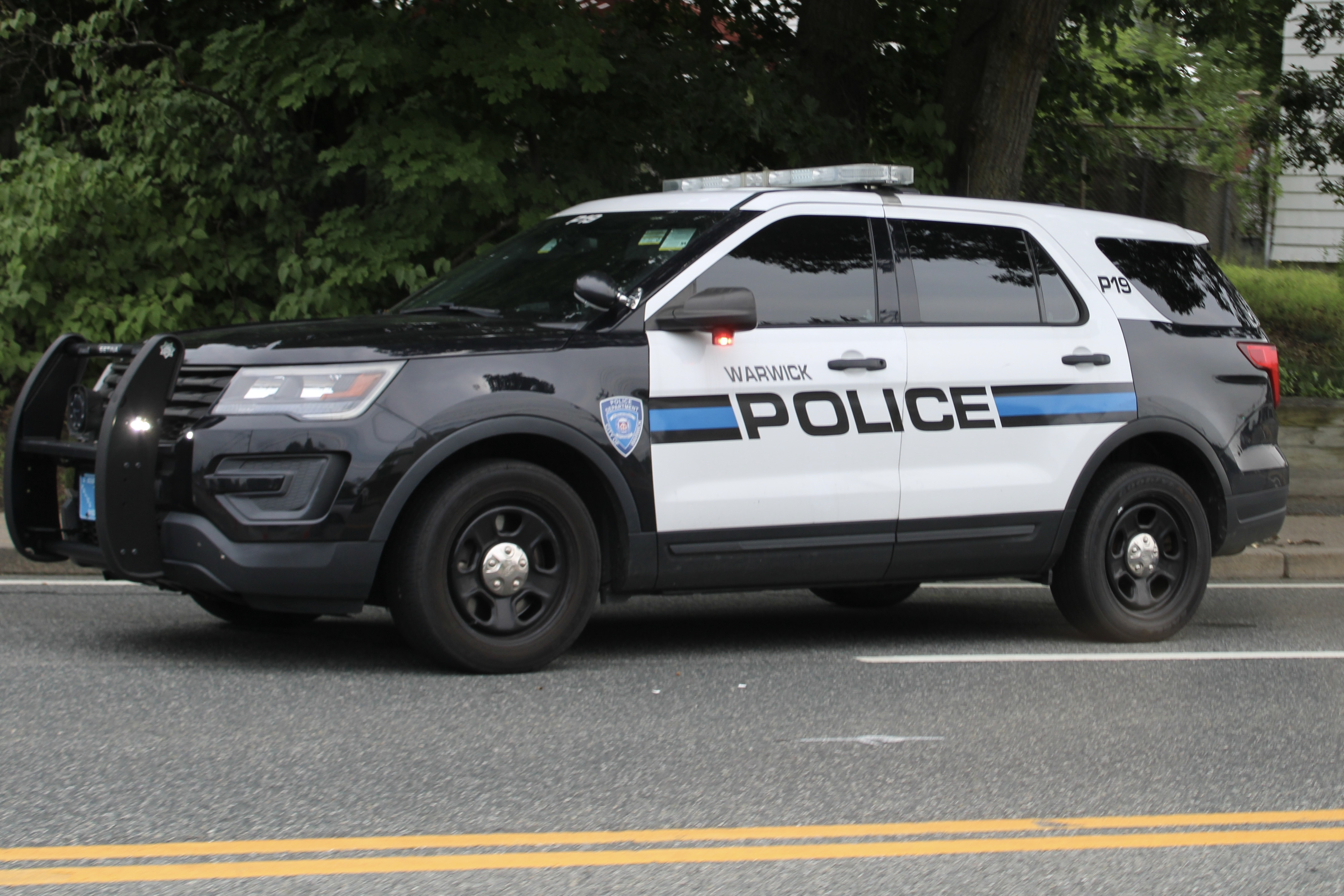 A photo  of Warwick Police
            Cruiser P-19, a 2019 Ford Police Interceptor Utility             taken by @riemergencyvehicles